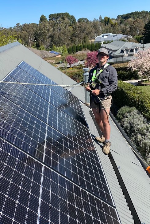 Solar installer finishing up a job in the Southern Highlands